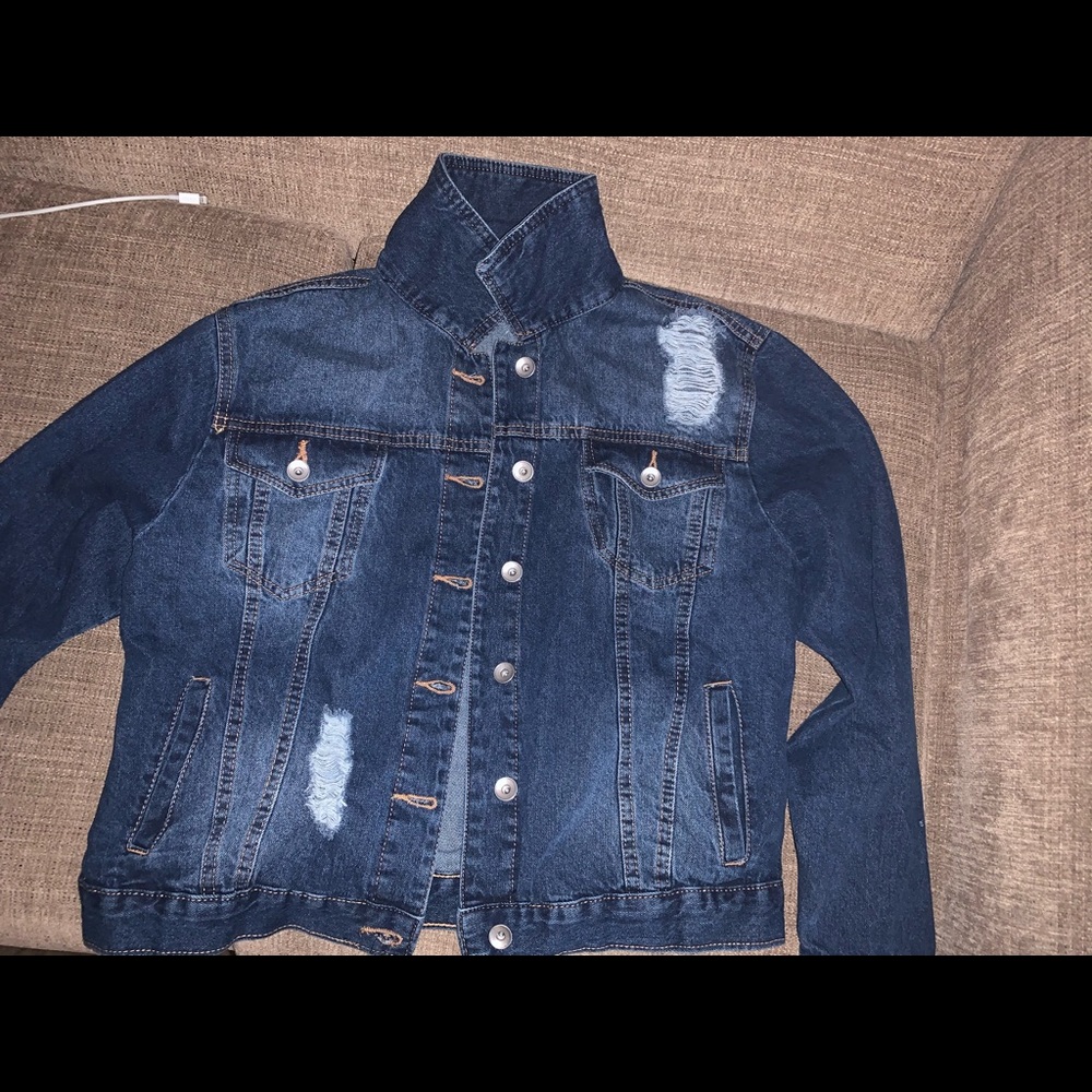 Ripped dark blue jeans